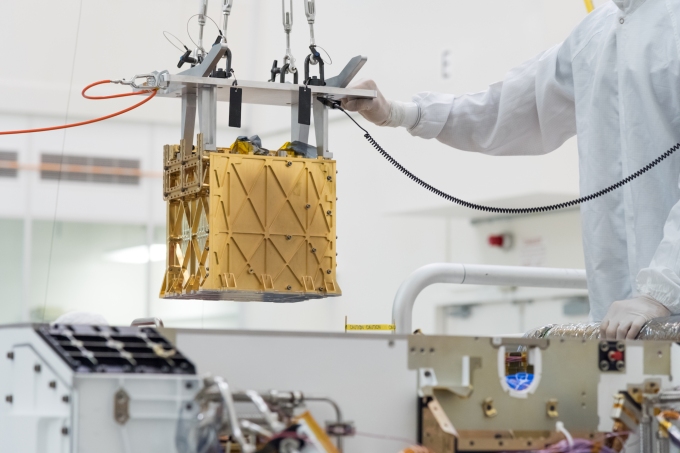 MOXIE instrument being installed on NASA's Perseverance rover.