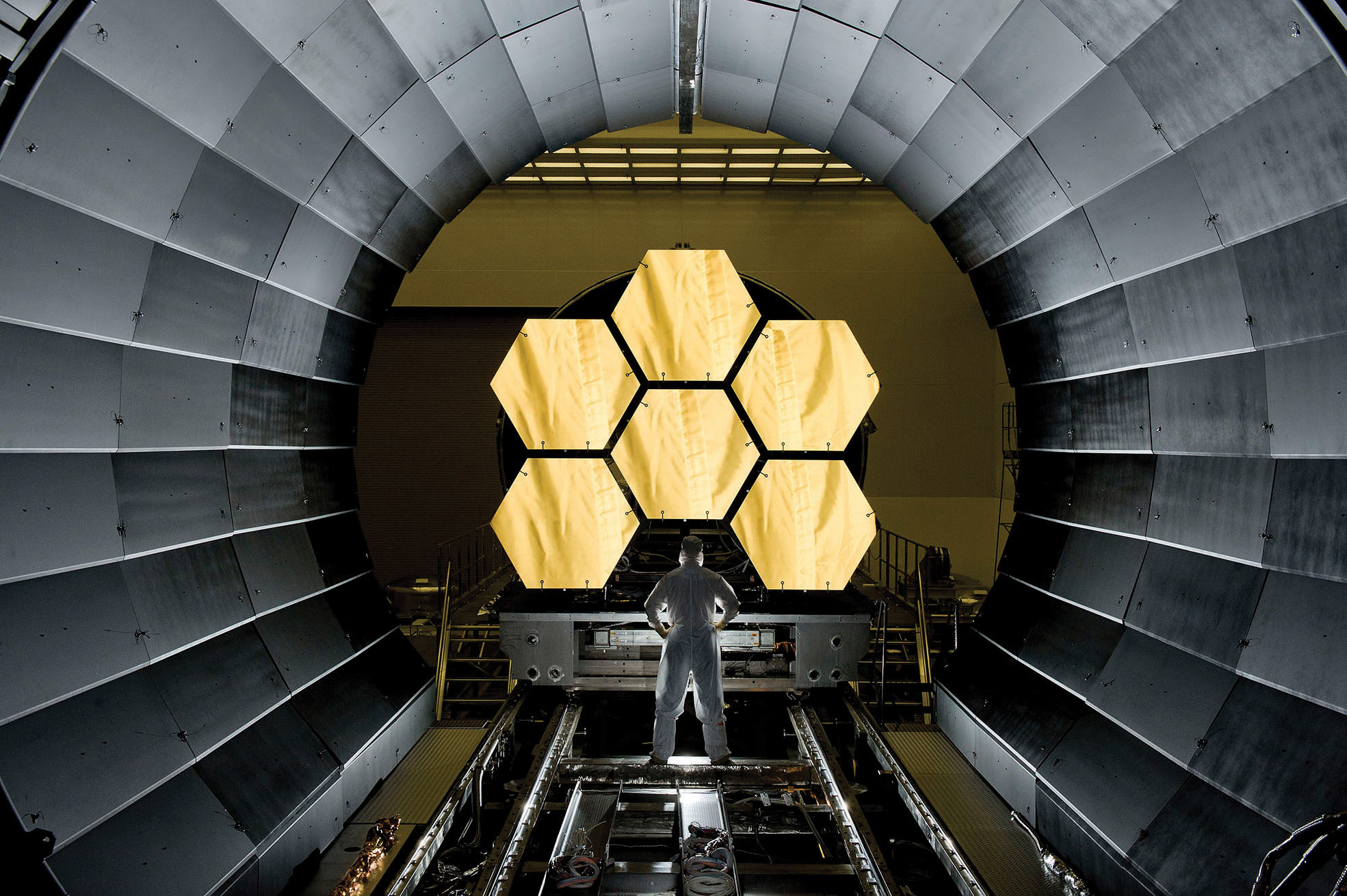 Ernie Wright stands near the JWST mirrors 