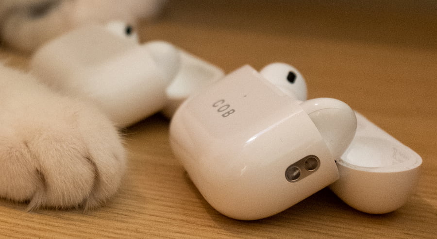 Left: Apple AirPods Pro 2nd generation Charging Case in Foreground