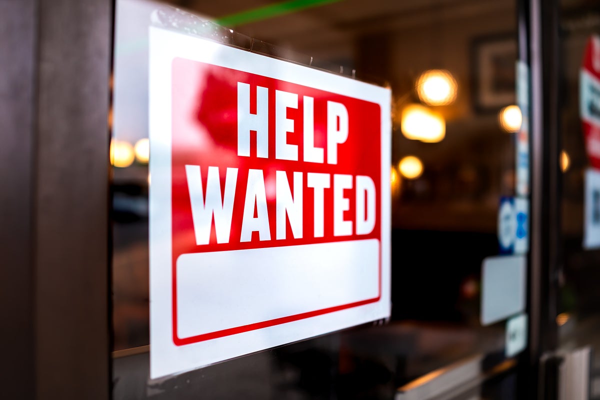 shutterstock 1840085851 help wanted sign in office window