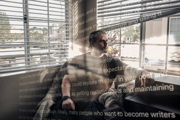 A man seated in an indoor corner with outdoor scenes visible through windows behind him and writing superimposed over his image.