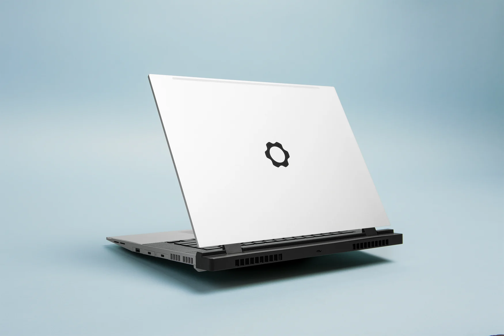 Image of the Framework Laptop 16 with the expansion bay cover attached to rear.