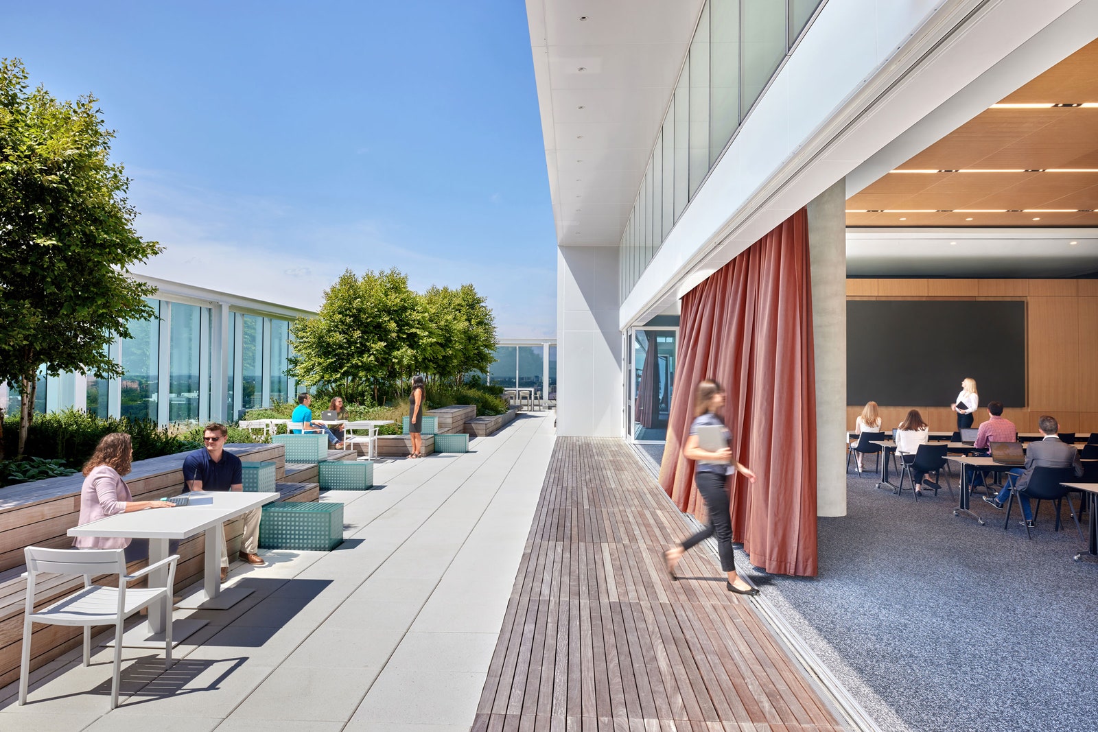 Open air office environment with indoor and outdoor workspace.