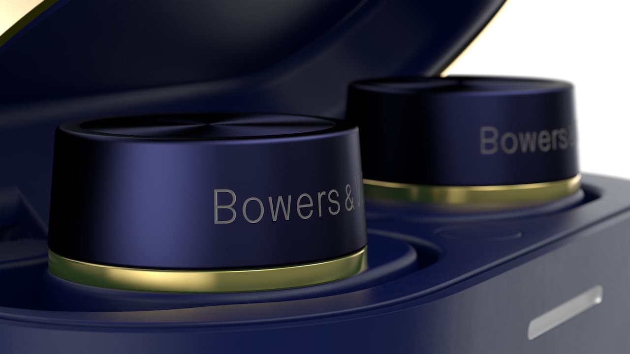 Bowers & Wilkins Pi7 S2 True Wireless Earbuds Peaking Out of Charging Case in Midnight Blue