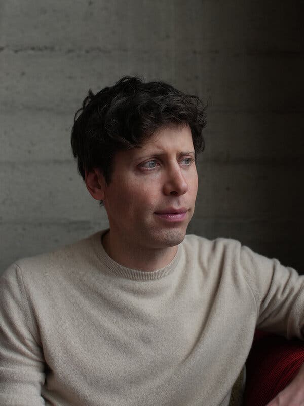 Sam Altman wearing a beige sweater.