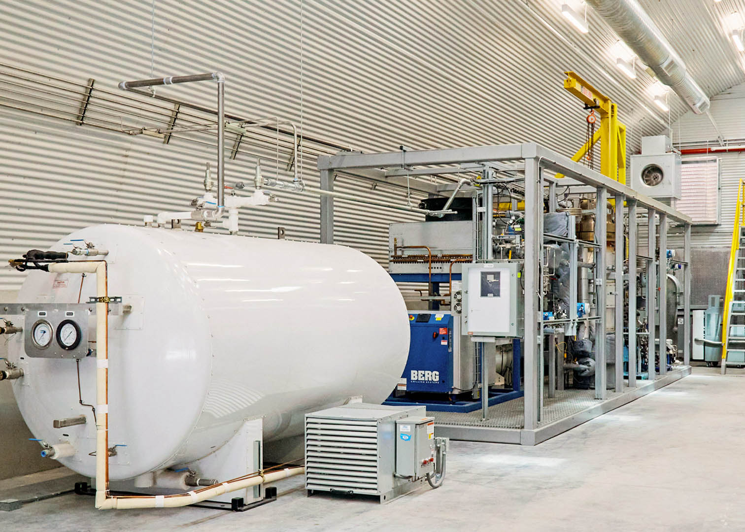 interior view of the Air Factory with a large pressurized metal tank in the foreground