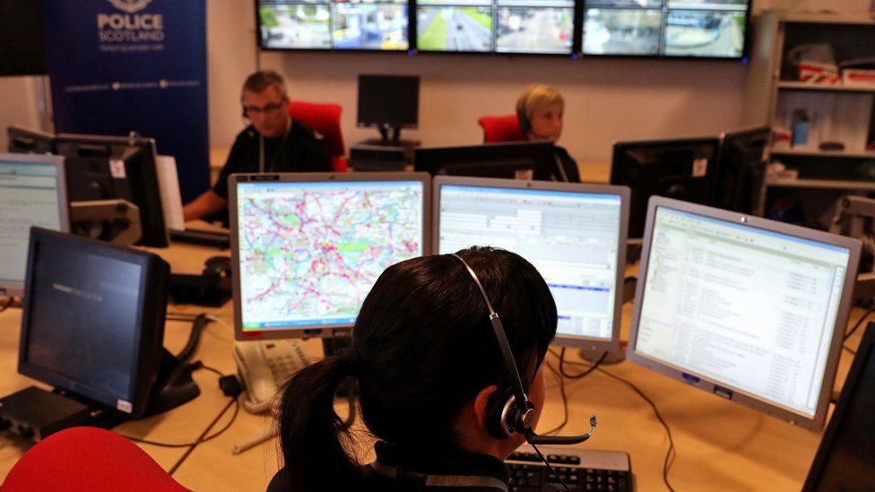 Officers at work in a control room