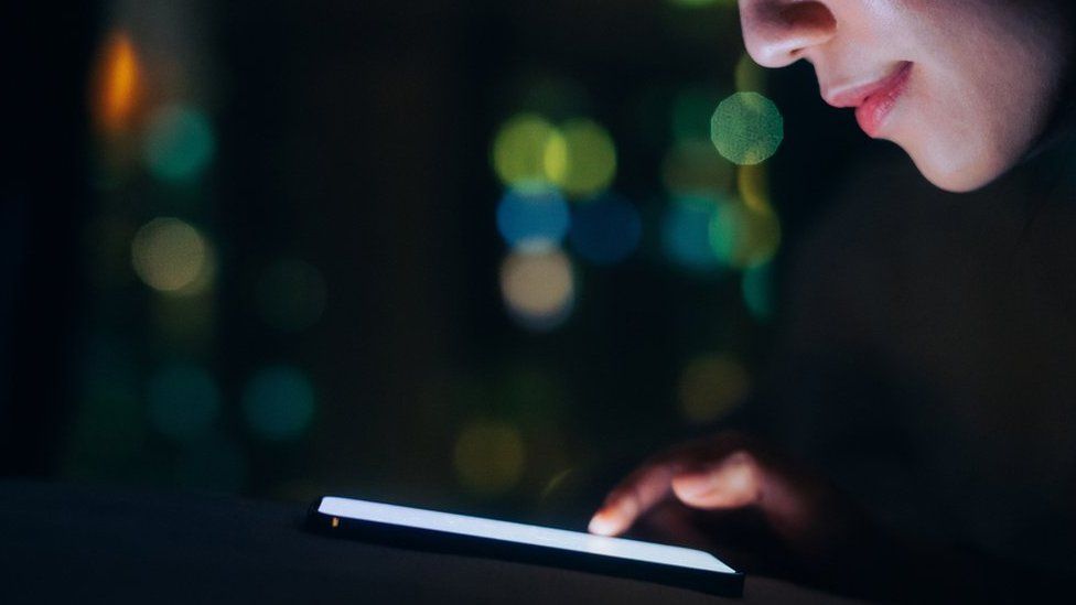 Woman looking at her smartphone