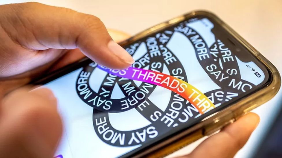 Threads logo on phone