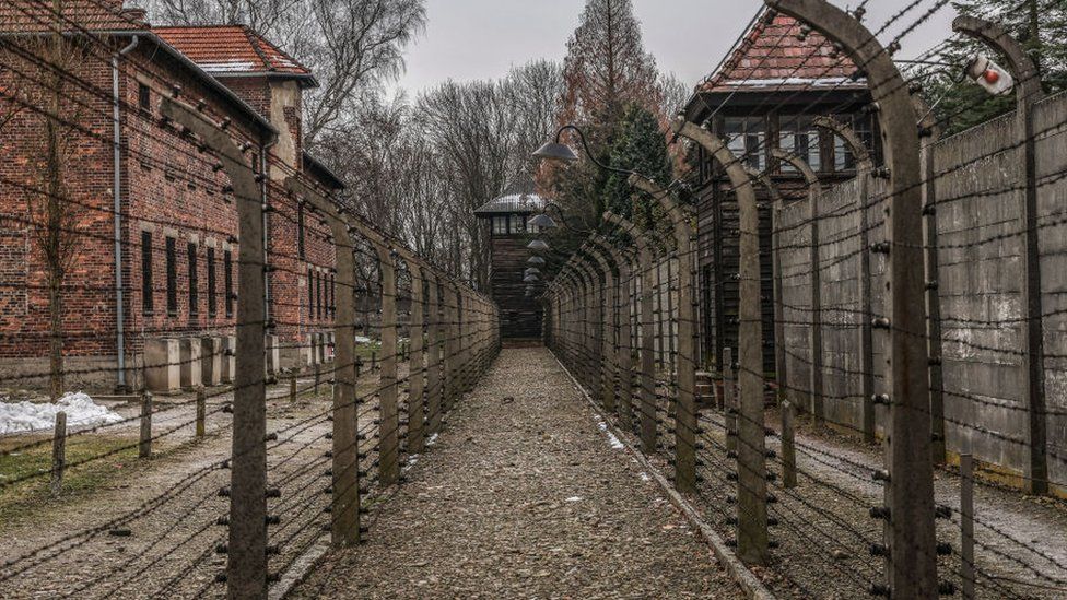 A photograph of barb wired fence in the former Nazi German Auschwitz I concentration camp