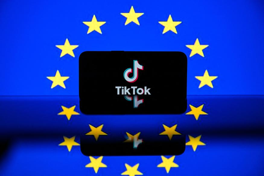 This picture taken on April 26, 2023 in Toulouse, southwestern France, shows a screen displaying the Tiktok social media platform's logo and the European flag. - European commissioner for the Internal Market Thierry Breton unveiled a list of 19 online platforms, including Instagram, TikTok and Twitter, as having user numbers so big they will come under stricter regulatory rules for content. The list which also includes services from Amazon, Google, Meta, Instagram and Microsoft puts them in a category under a new EU law, known as the Digital Services Act (DSA), imposing measures from August such as annual audits and a duty to effectively counter disinformation and hate content. (Photo by Lionel BONAVENTURE / AFP) (Photo by LIONEL BONAVENTURE/AFP via Getty Images)