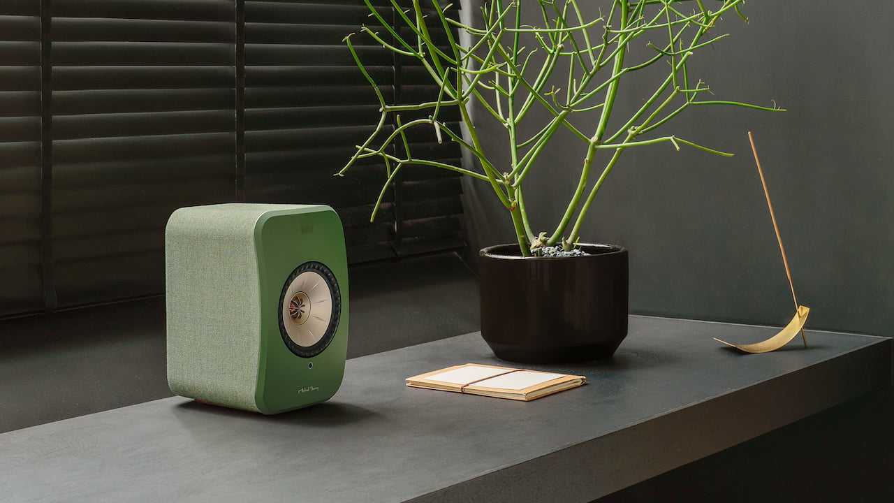 KEF LSX II Wireless Speaker in olive green with plant