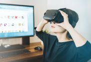 women with headset on in front of computer; new web 3D