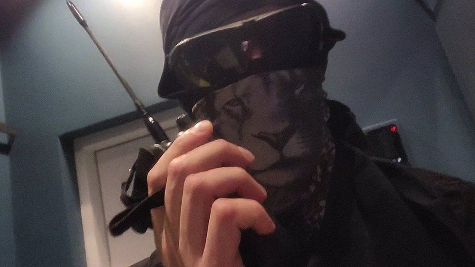 A member of the Squad 303/Anonymous hacker group