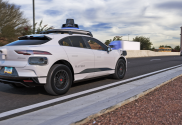 Waymo tests self-driving cars on Phoenix highways. White car seen on the road