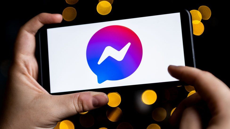 A stock image of the messenger logo on a phone screen