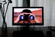 Photo of computer screen showing binoculars with Facebook's logo