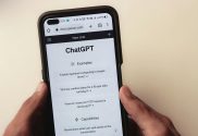 An image showing a mobile phone screen with OpenAI's ChatGPT app on screen.