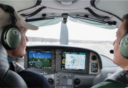 An image of two pilots in a small aircraft